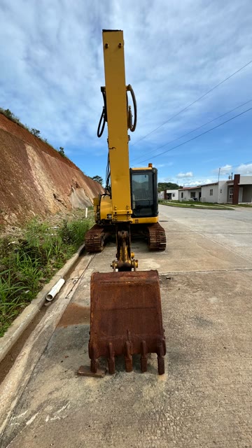 Excavadora CAT, cucharón de frente